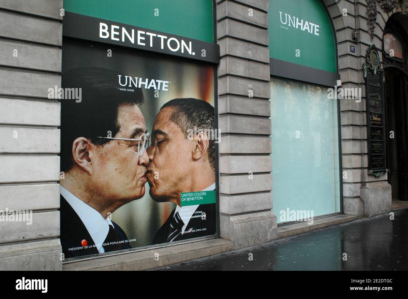 Posters from new Benetton's ad campaign 'Unhate' are on display on it's  flagship store windows, Place de l'Opera in Paris, France, November 17,  2011. They show various pictures of political opponents kissing.