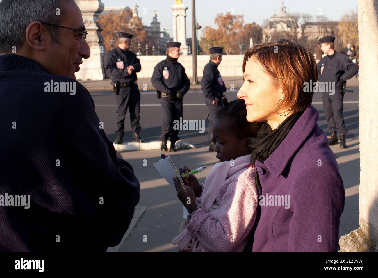 French parents with adopted Haitian children take part in a demonstration in front of France's Foreign Affairs ministry in Paris, France, on November 19, 2011 to ask French authorities to give a legal statute for the little survivors of the Haiti quake they adopted. On the picture, a child tries to give to the authorities a doll. Photo by Stephane Lemouton/ABACAPRESS.COM Stock Photo