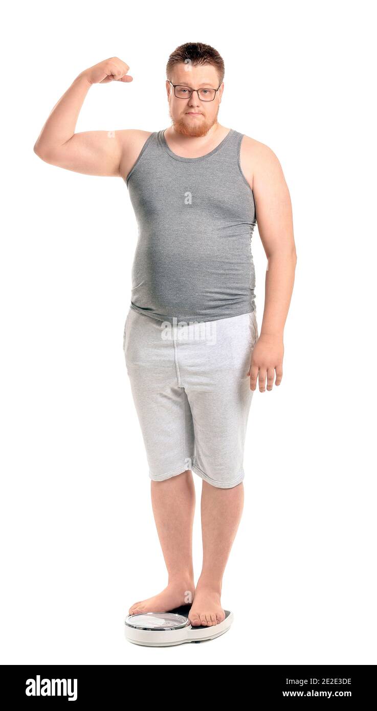 Overweight man with scales on white background. Weight loss concept Stock Photo