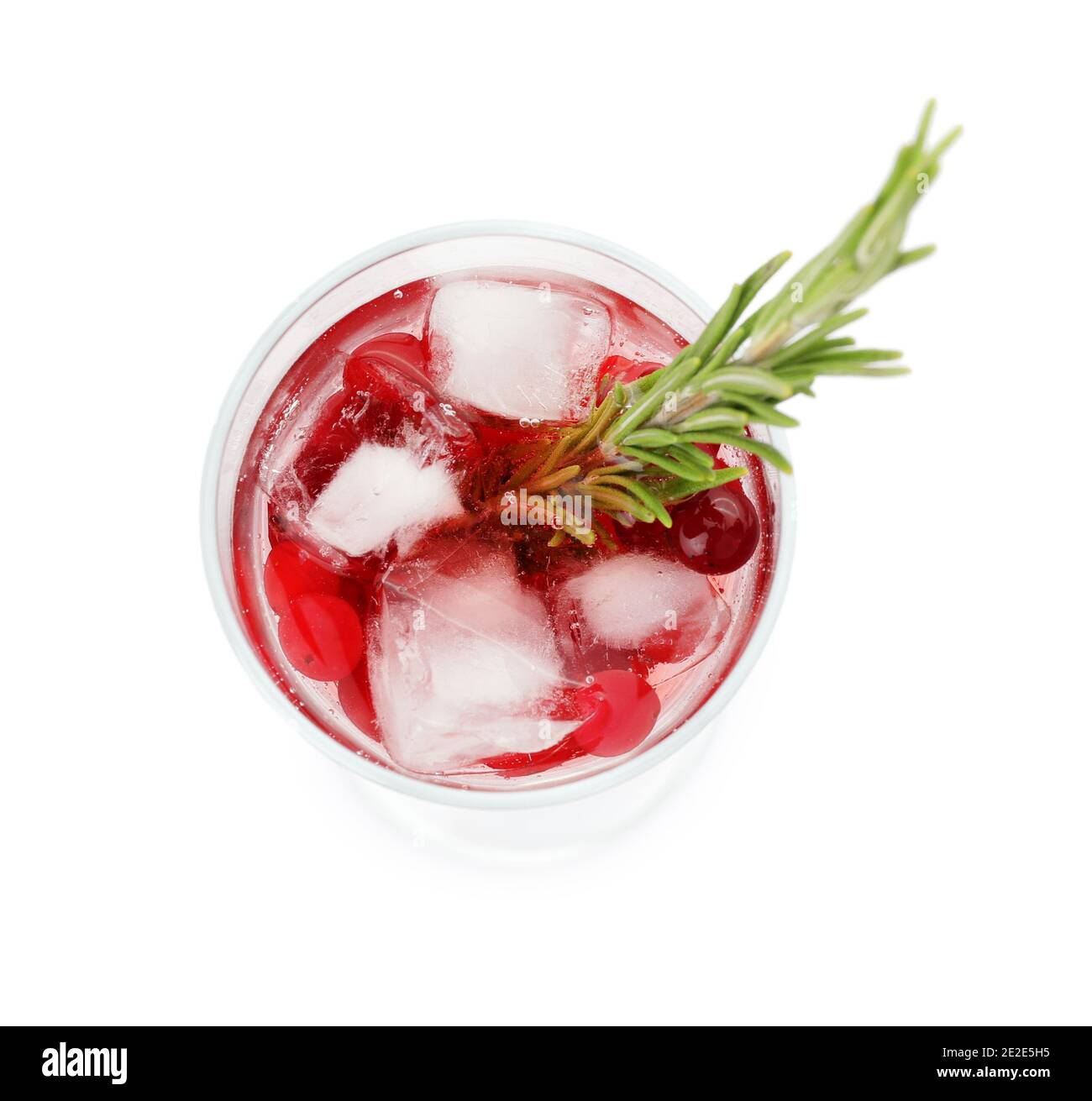 Glass of champagne cocktail with cranberry and rosemary on white background Stock Photo