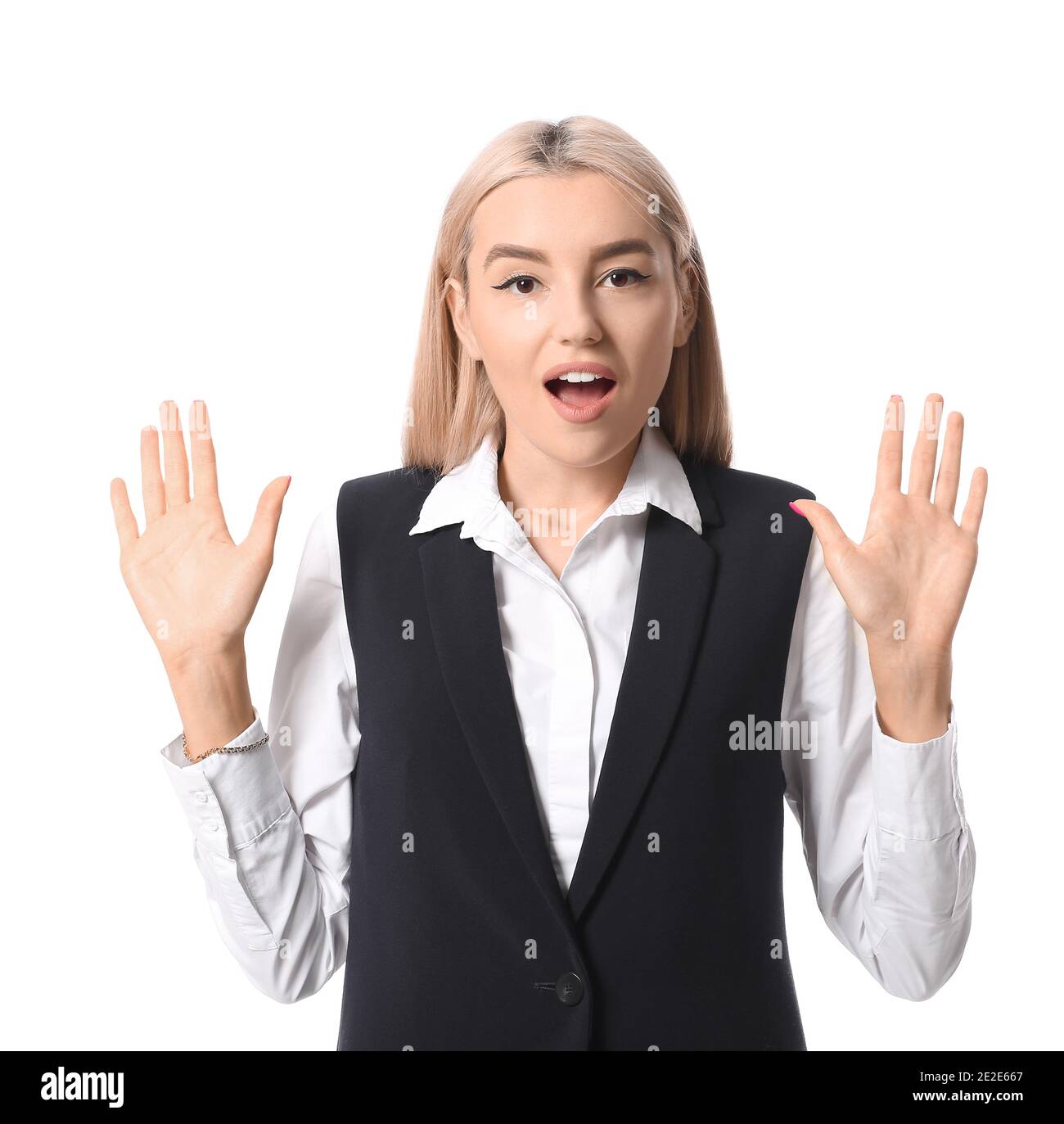 Surprised young woman on white background Stock Photo - Alamy