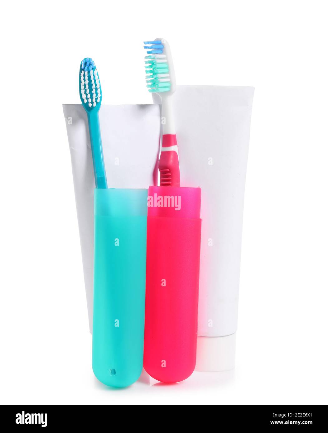 Toothbrushes, cases and paste on white background Stock Photo Alamy
