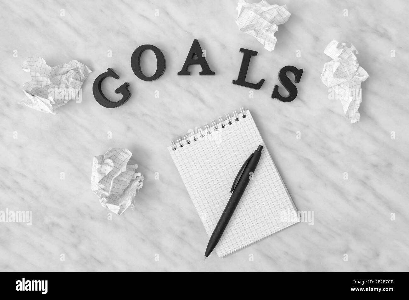 Notebook, pen and word GOALS on light background Stock Photo