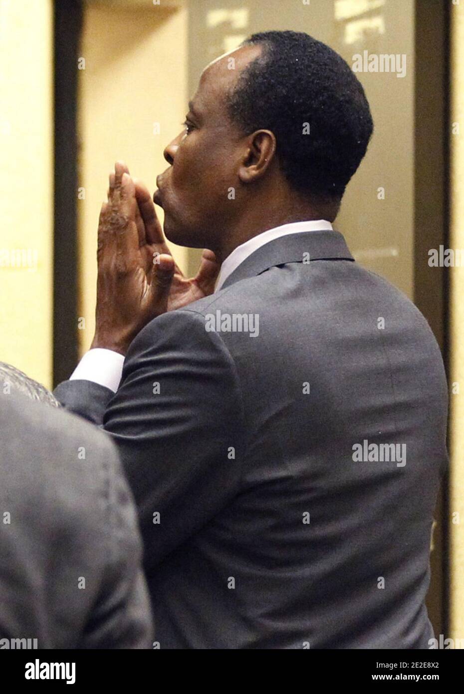 Dr. Conrad Murray blows a kiss to an unidentified member of the courtroom audience after he was sentenced to four years in county jail for his involuntary manslaughter conviction of pop star Michael Jackson in Los Angeles, CA, USA, on November 29, 2011. Photo by Mario Anzuoni/Pool/ABACAPRESS.COM Stock Photo