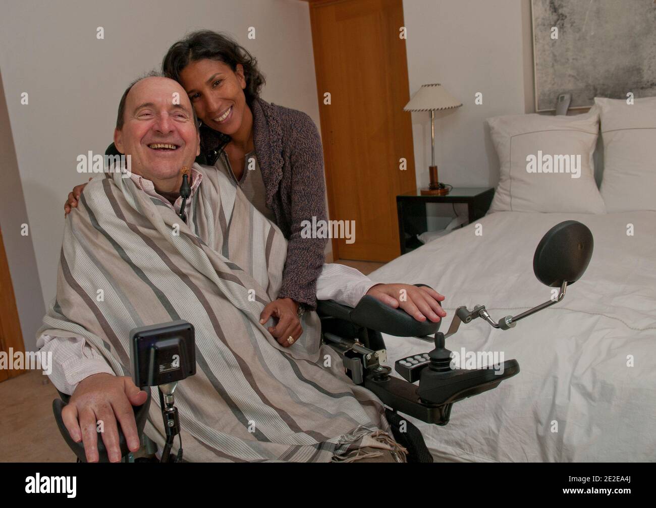 EXCLUSIVE - Philippe Pozzo di Borgo, who became quadriplegic after a paragliding accident in 1993, poses with his wife Khadija at their home in Essaouira, Morocco, November 15, 2011. His story inspired the movie 'Intouchables' directed by Olivier Nakache and Eric Toledano, released in France on November 2011, in which the actor Francois Cluzet plays his role and actor Omar Sy plays Abdel Seliou's role. In France, the movie reached 10 million of filmgoers. Photo by William Stevens/ABACAPRESS.COM Stock Photo