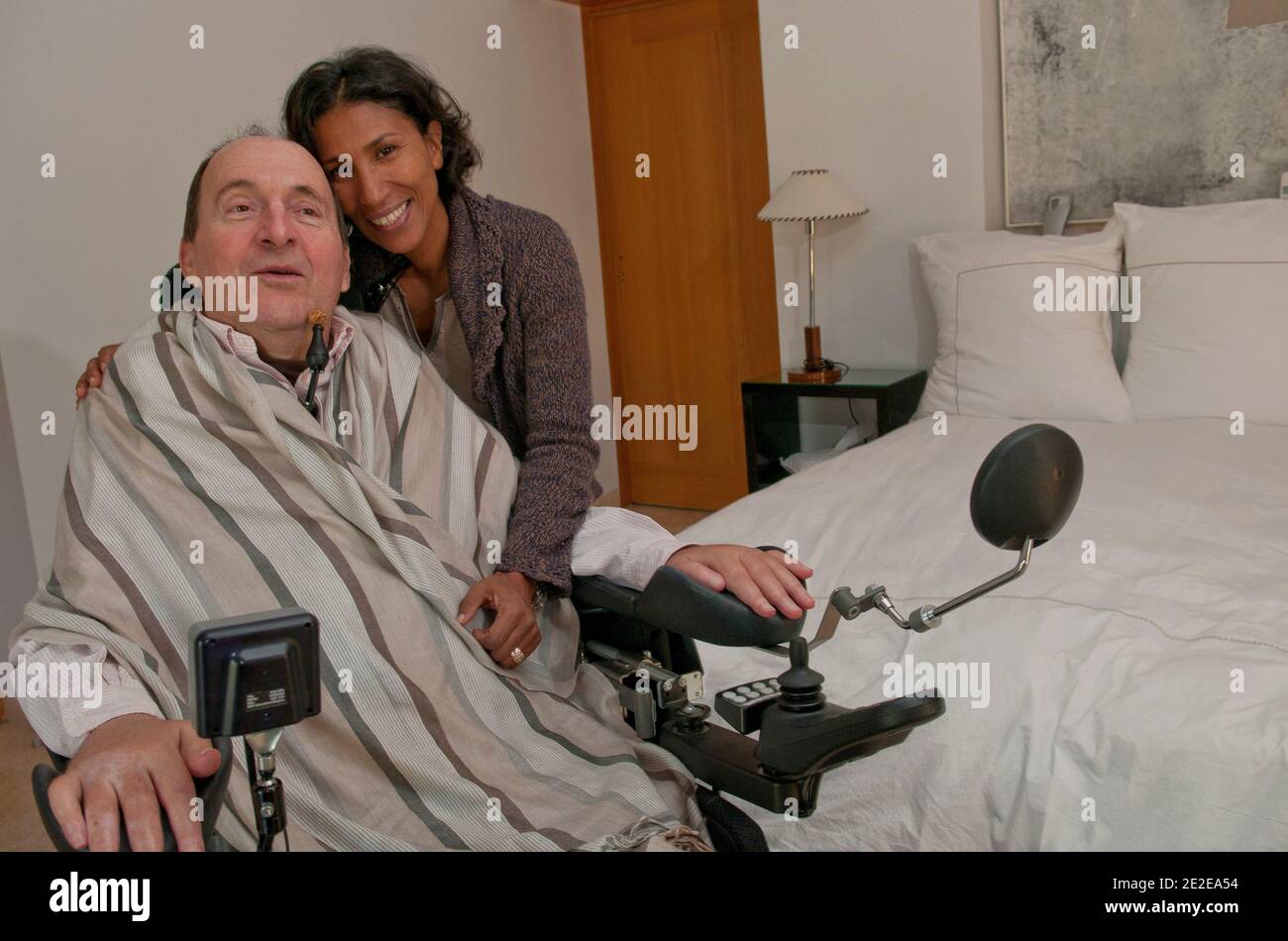 EXCLUSIVE - Philippe Pozzo di Borgo, who became quadriplegic after a paragliding accident in 1993, poses with his wife Khadija at their home in Essaouira, Morocco, November 15, 2011. His story inspired the movie 'Intouchables' directed by Olivier Nakache and Eric Toledano, released in France on November 2011, in which the actor Francois Cluzet plays his role and actor Omar Sy plays Abdel Seliou's role. In France, the movie reached 10 million of filmgoers. Photo by William Stevens/ABACAPRESS.COM Stock Photo