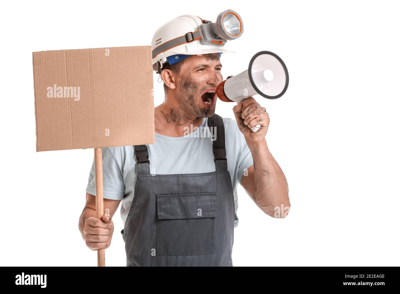 Protesting miner man with megaphone and placard on white background Stock Photo