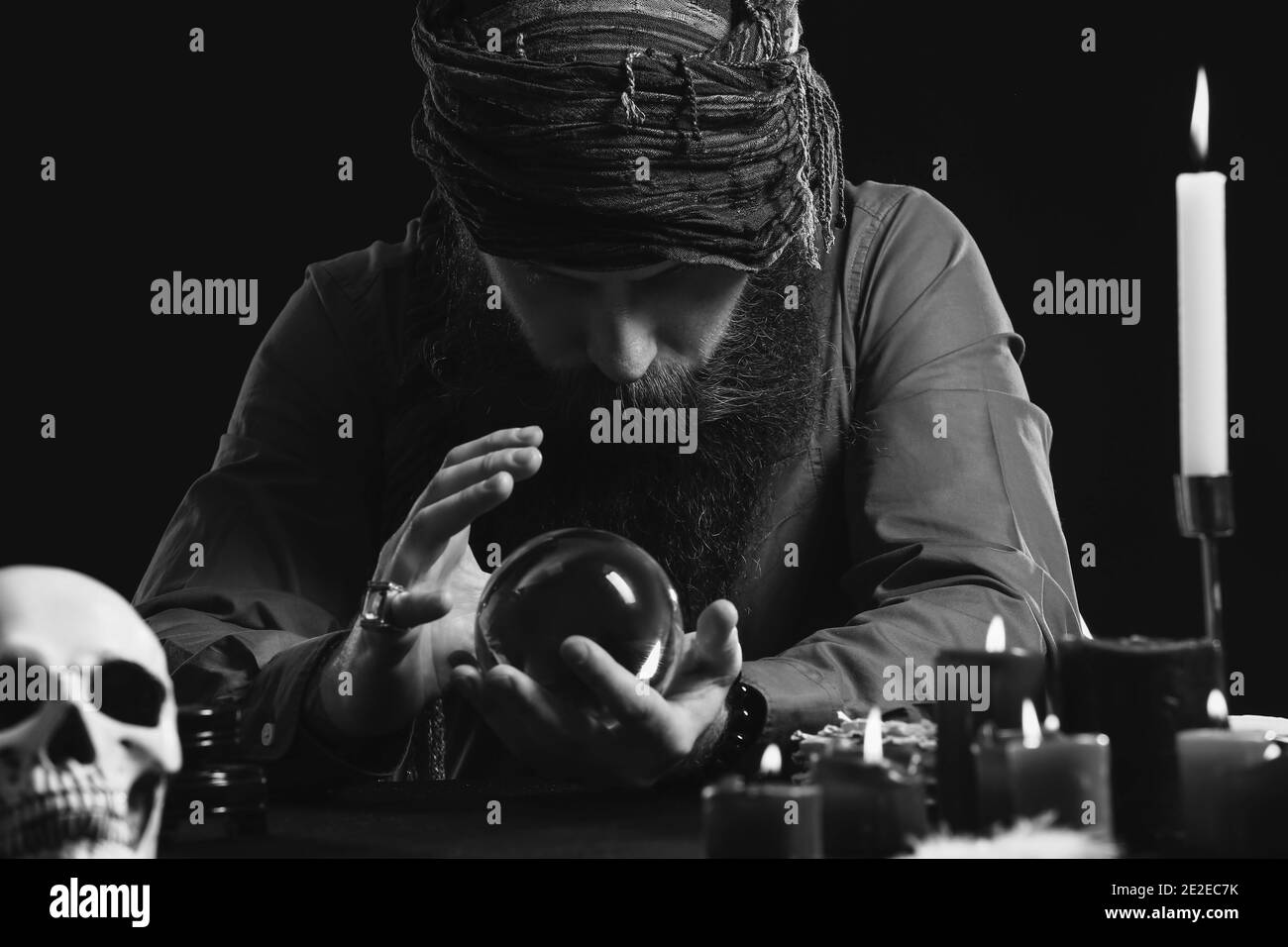 Black and white photo of male fortune teller at table Stock Photo Alamy