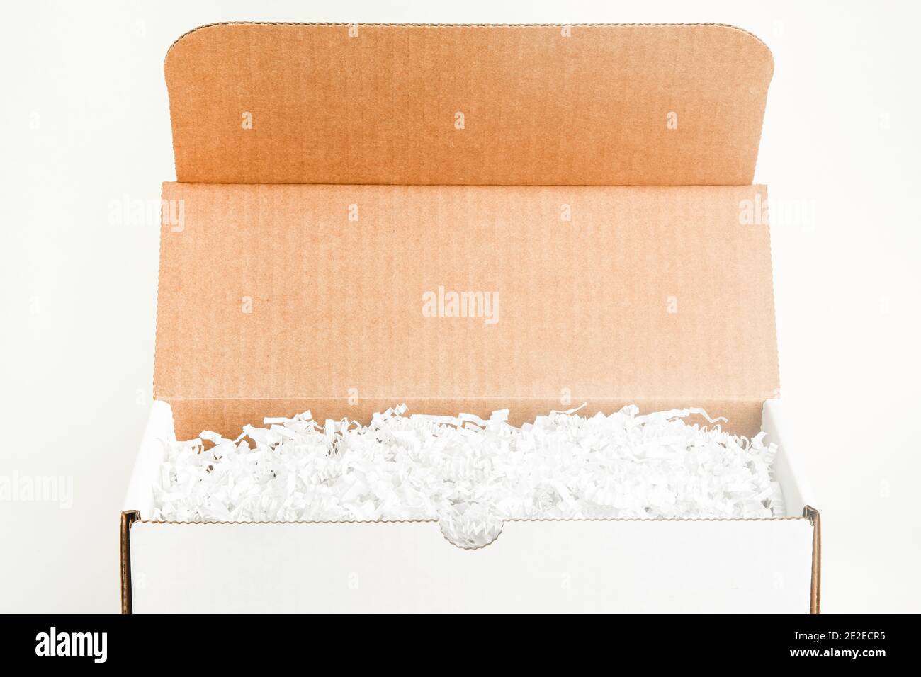 An open white rectangular cardboard packaging box set on plain white background. Stock Photo