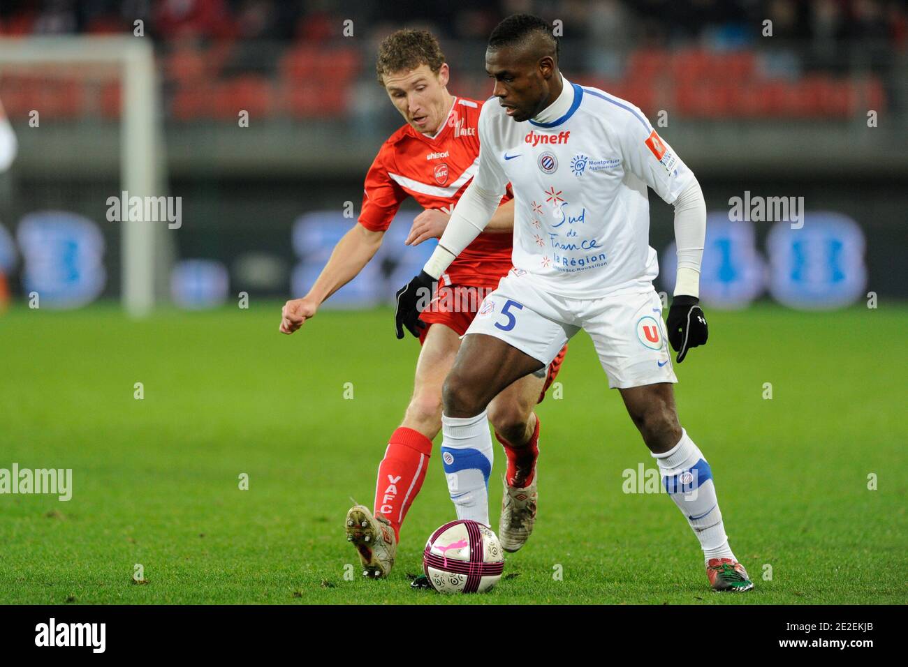 Valenciennes's David Ducourtioux battling Montpellier's Henri Bedimo during the French First League soccer match, Valenciennes vs Montpellier in Valenciennes, France, on December 10th, 2011. Valenciennes won 1-0. Photo by Henri Szwarc/ABACAPRESS.COM Stock Photo