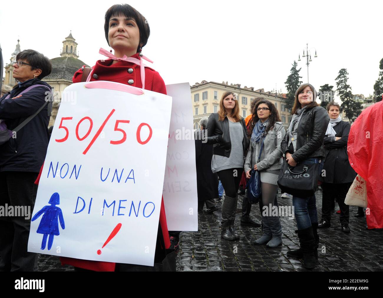 Thousands of italian women rallied for more equal future in Rome, Italy on December 11, 2011. The slogans were ' 50 - 50' and 'If not now, when?', the same that earlier this year spurred a nationwide protest against the image of Italian women that Berlusconi was giving to the world. A prime cause of Italy's recent low growth is female participation in the workforce which, according to the World Economic Forum, is lower than in any other European country except Macedonia. In the 2011 WEF global gender gap report, it was ranked 48 places behind Mozambique - 74th out of the 135 countries surveyed Stock Photo