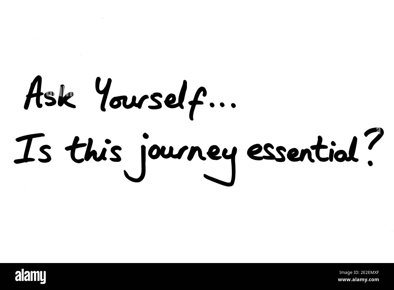 Ask Yourself…Is this journey essential? handwritten on a white background. Stock Photo