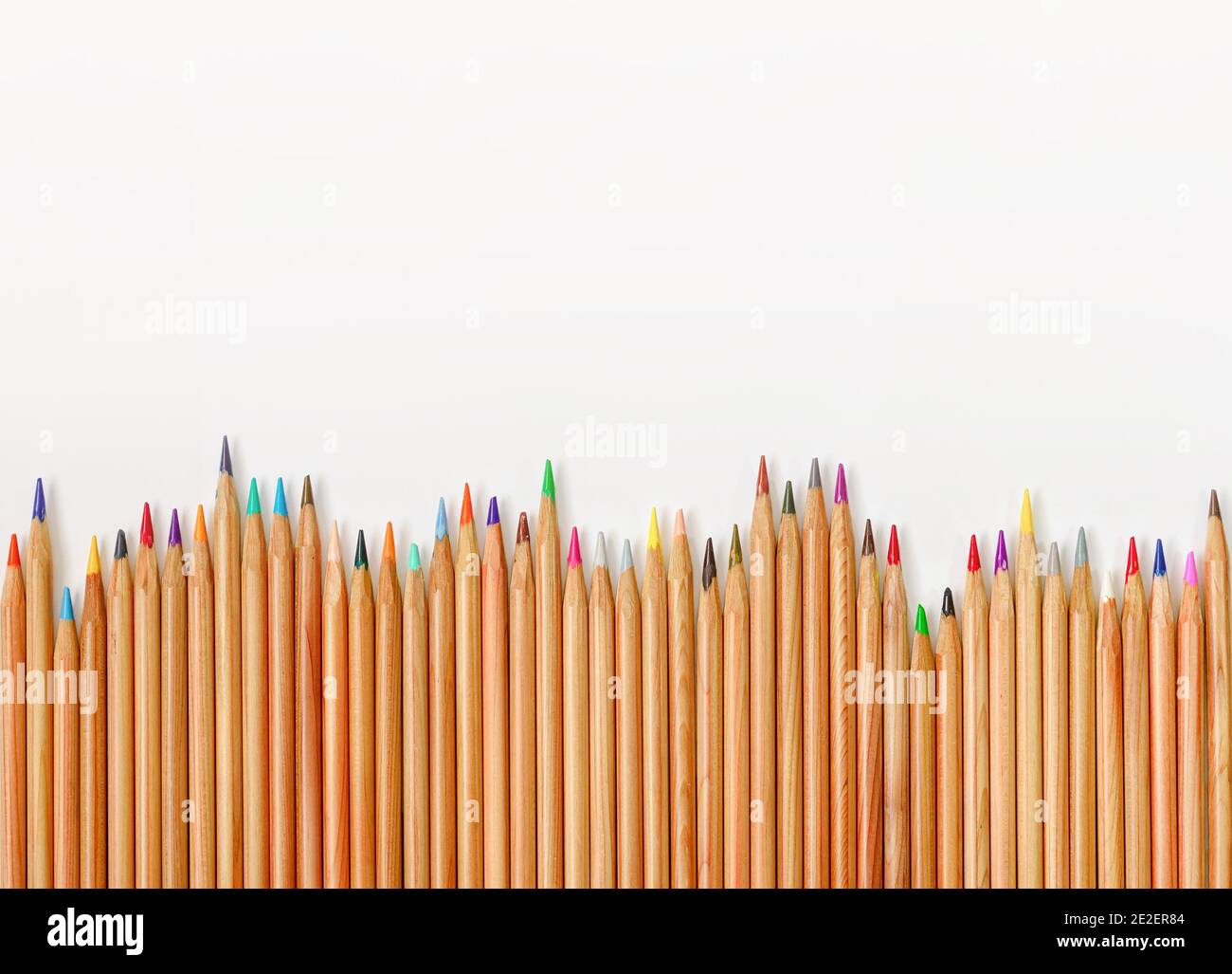 Color pencils with blank space on white background frame concept stock 
