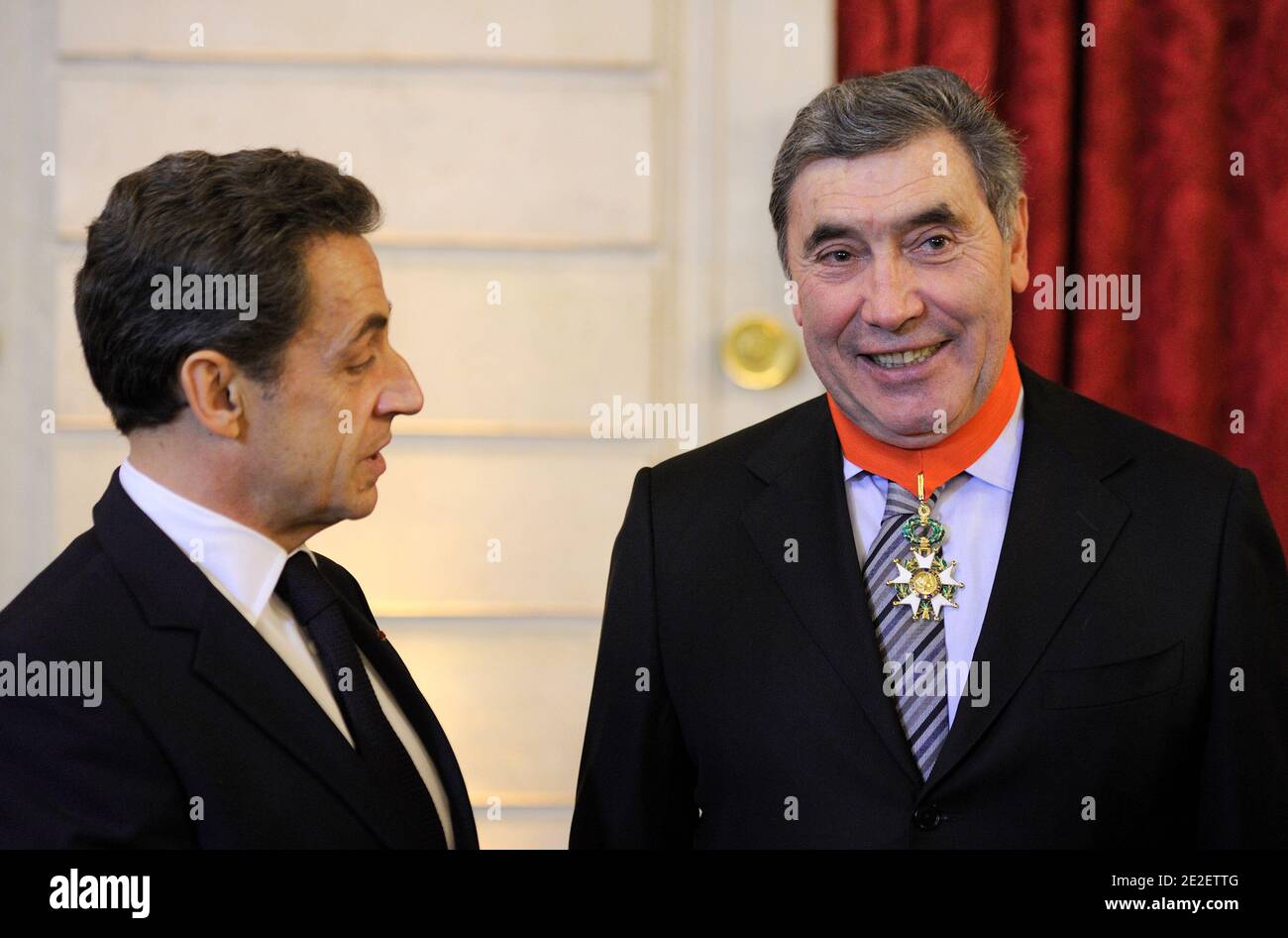 French President Nicolas Sarkozy (L) awards Belgian cycling legend Eddy Merckx as the highest possible Legion of Honour grade 'Commandeur de la Legion d'Honneur' at the presidential Elysee palace in Paris, France on December 15, 2011. Boasting victories in almost every professional race of significance, Merckx, known as 'the Cannibal' for his voracious victory appetite, is considered the most successful cyclist of all time. Photo by Eric Feferberg/Pool/ABACAPRESS.COM Stock Photo