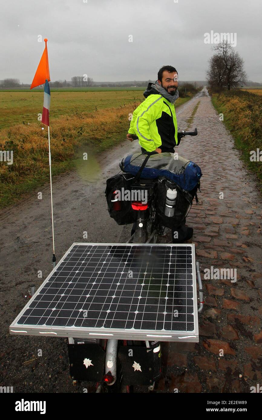 Thibaut Dubrulle, 24, arrives in Lille, France on December 16, 2011, after he completed his trip from Shanghai, China, to Lille in northern France with his solar powered electric bicycle. Dubrulle left China on July. 24, 2011 to cycle through Kyrgyzstan, Tajikistan, Uzbekistan, Iran, Turkey and Italy in a journey of around 13000 kms ( 8077 miles). Photo by Jean-Yves Bonvarlet/ABACAPRESS.COM Stock Photo