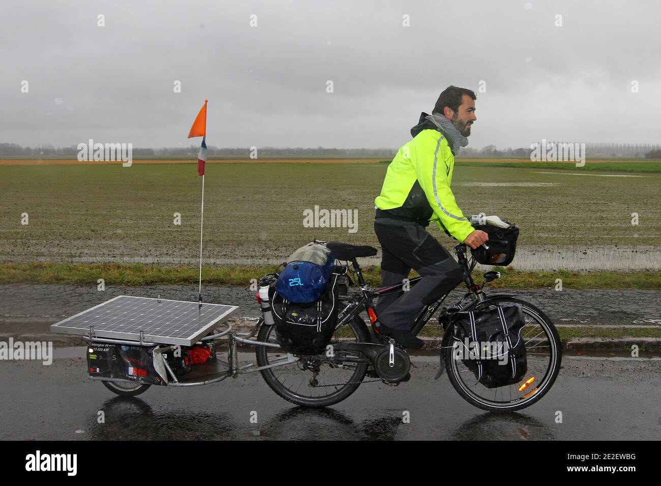 Thibaut Dubrulle, 24, arrives in Lille, France on December 16, 2011, after he completed his trip from Shanghai, China, to Lille in northern France with his solar powered electric bicycle. Dubrulle left China on July. 24, 2011 to cycle through Kyrgyzstan, Tajikistan, Uzbekistan, Iran, Turkey and Italy in a journey of around 13000 kms ( 8077 miles). Photo by Jean-Yves Bonvarlet/ABACAPRESS.COM Stock Photo