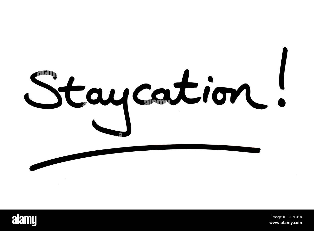 The word Staycation! handwritten on a white background. Stock Photo