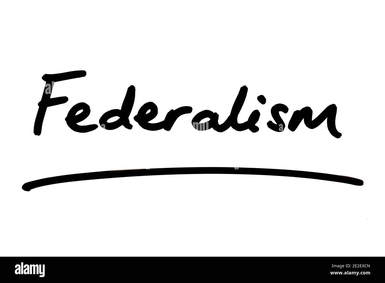 The word Federalism handwritten on a white background. Stock Photo