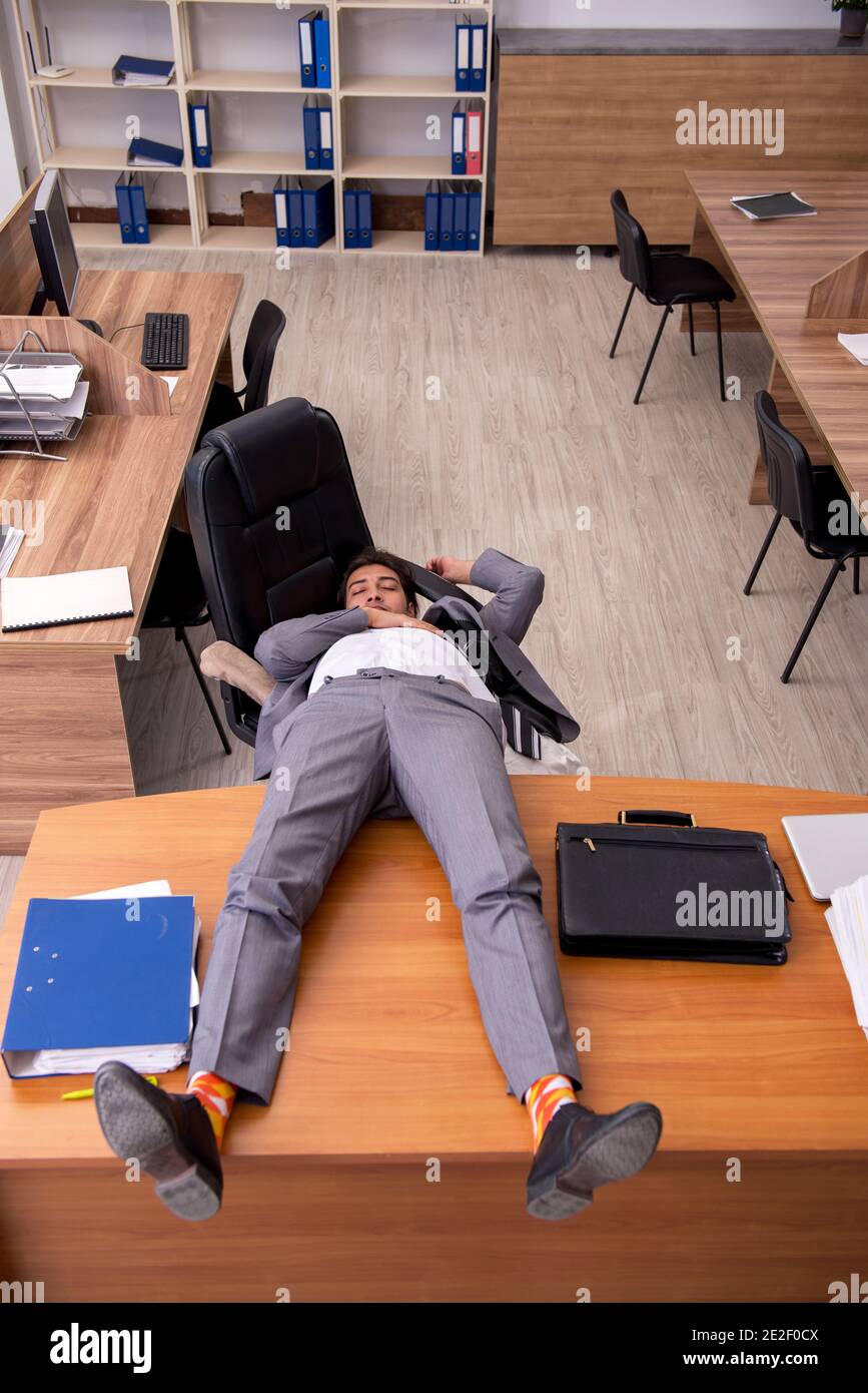 Young employee sleeping at workplace Stock Photo Alamy