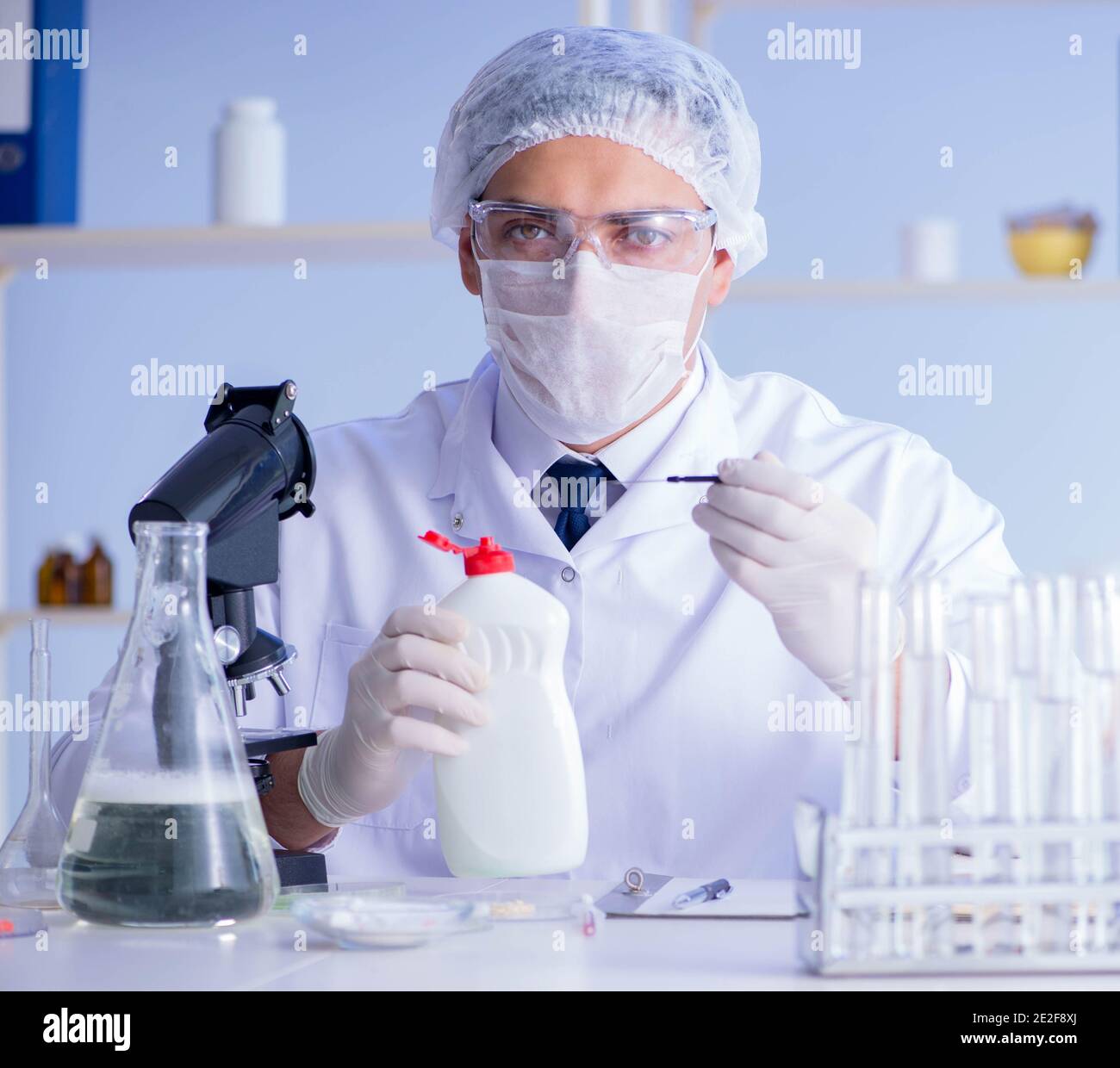 The man in the lab testing new cleaning solution detergent Stock Photo