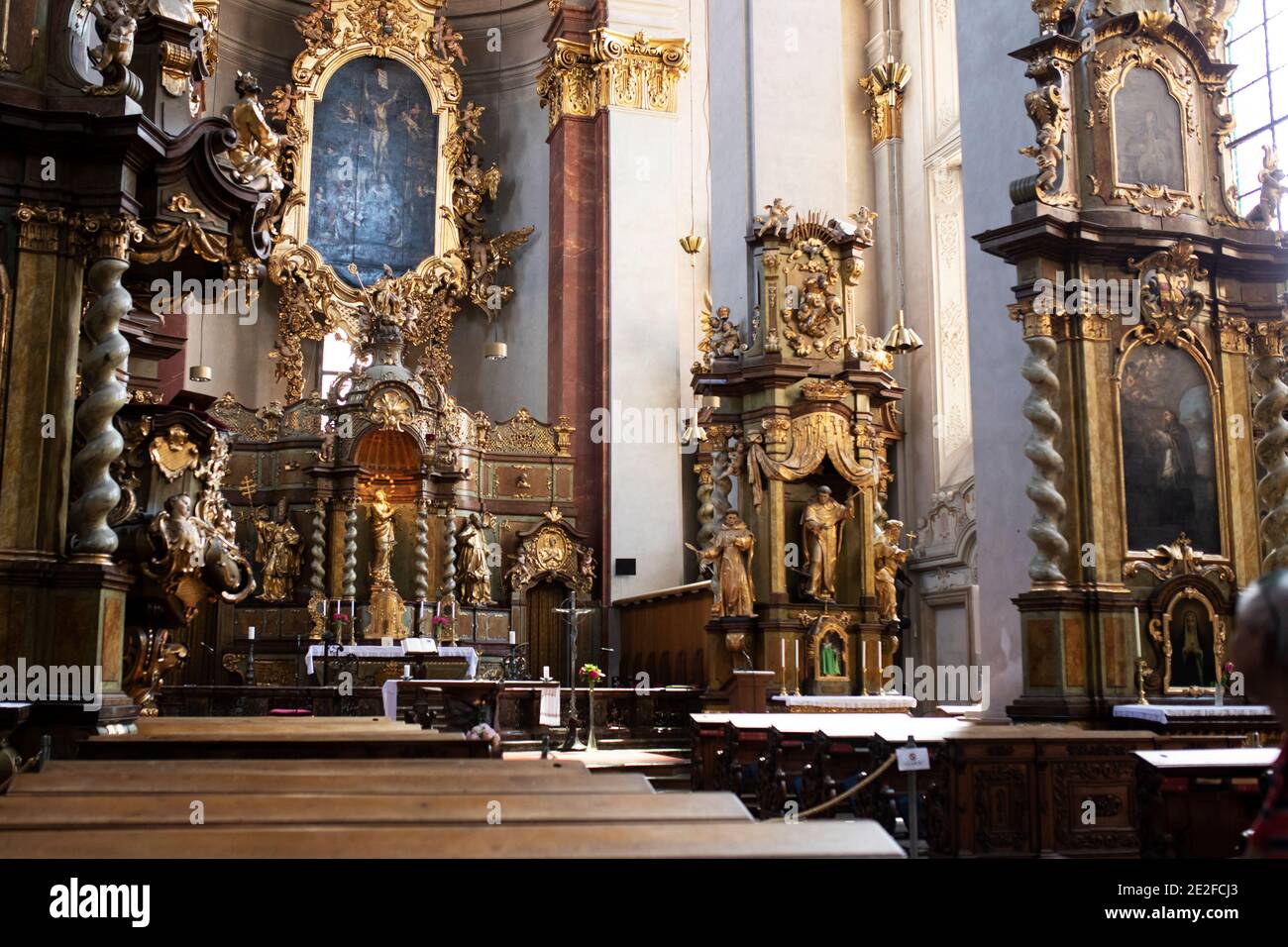 The interior and altar of Church of Our Lady Victorious and The Infant Jesus of Prague, a Baroque church from 1613 in Prague, Czechia. Stock Photo