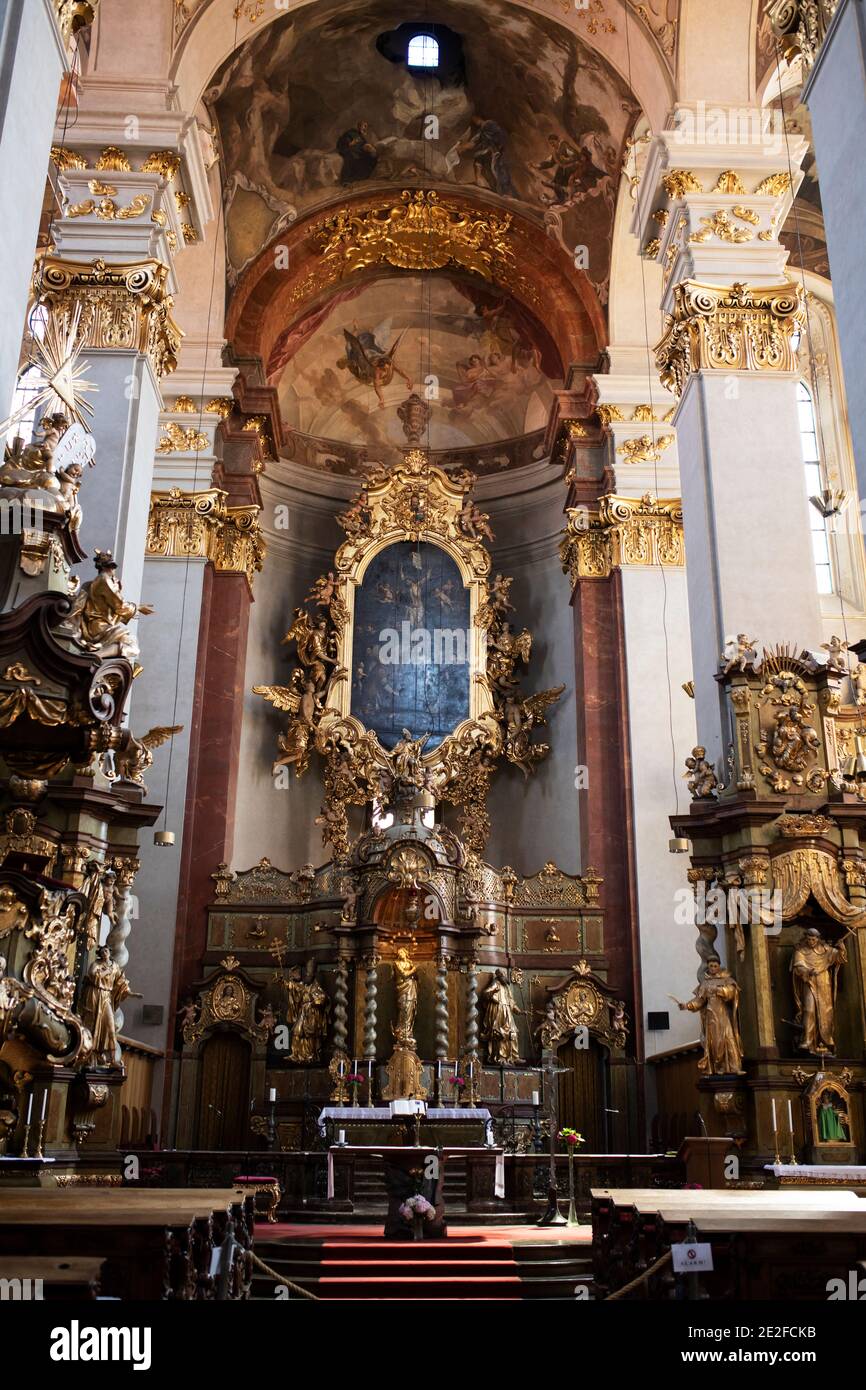 The interior and altar of Church of Our Lady Victorious and The Infant Jesus of Prague, a Baroque church from 1613 in Prague, Czechia. Stock Photo