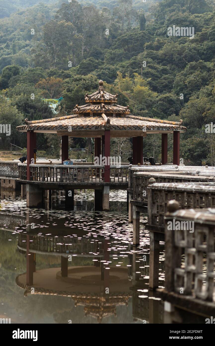 A pavilion on the lotus pool inside an oriental retreat, Lung Tsai Ng Garden, Lantau Island, Hong Kong Stock Photo