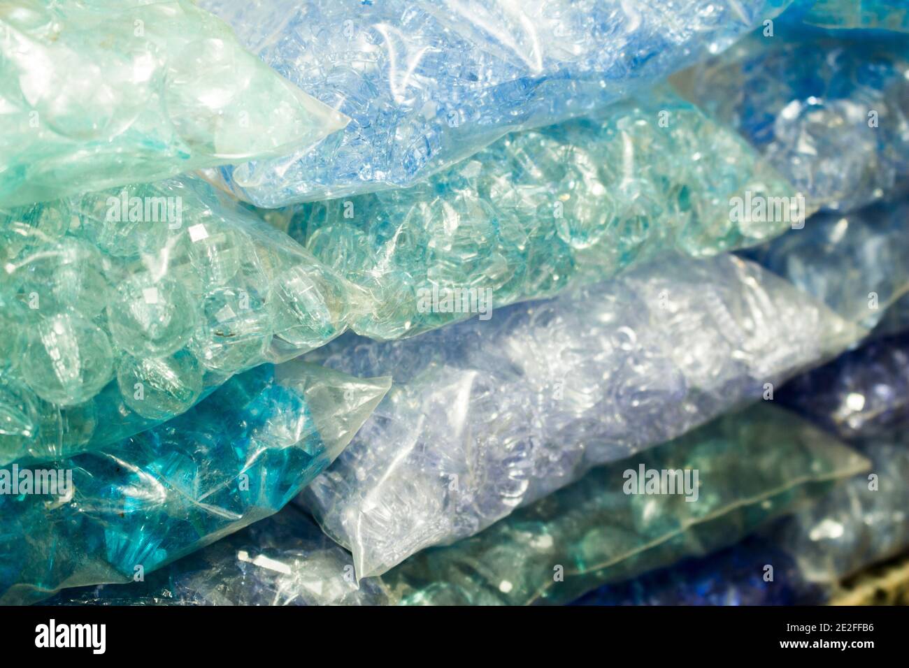 Stacks of blue crystals and pearls packages for bijou Stock Photo
