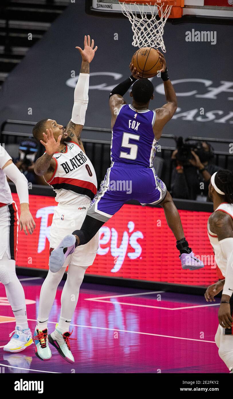 Sacramento, CA, USA. 13th Jan, 2021. Sacramento Kings guard De'Aaron Fox  (5) drives to the basket past Portland Trail Blazers guard Damian Lillard  (0) in the first quarter during a game at
