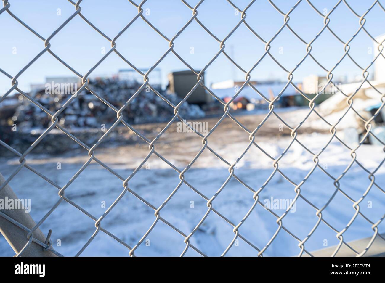 Chain link fence with Garbage recycle dump behind it Stock Photo Alamy