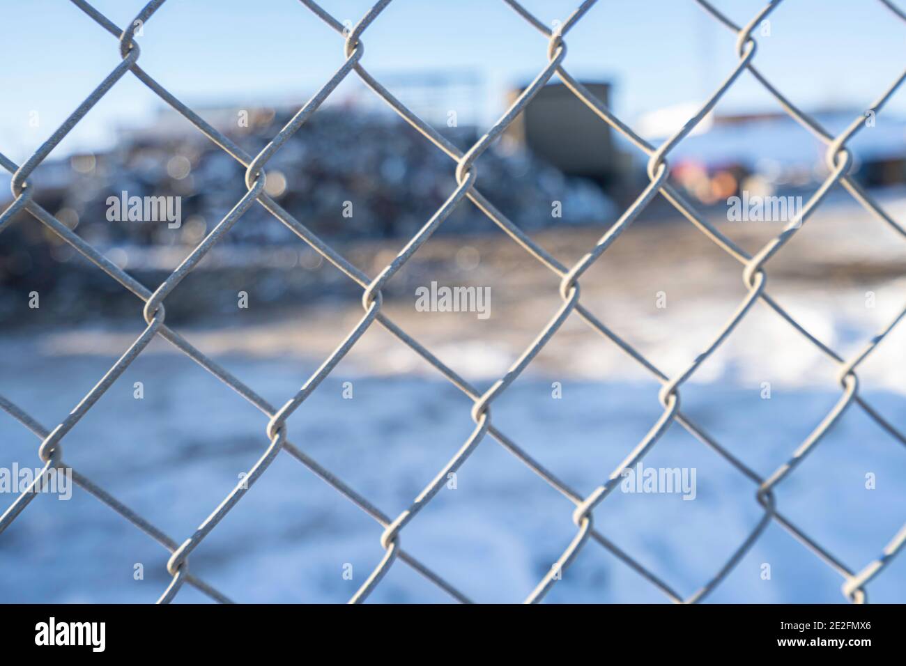 Chain link fence with Garbage recycle dump behind it Stock Photo Alamy