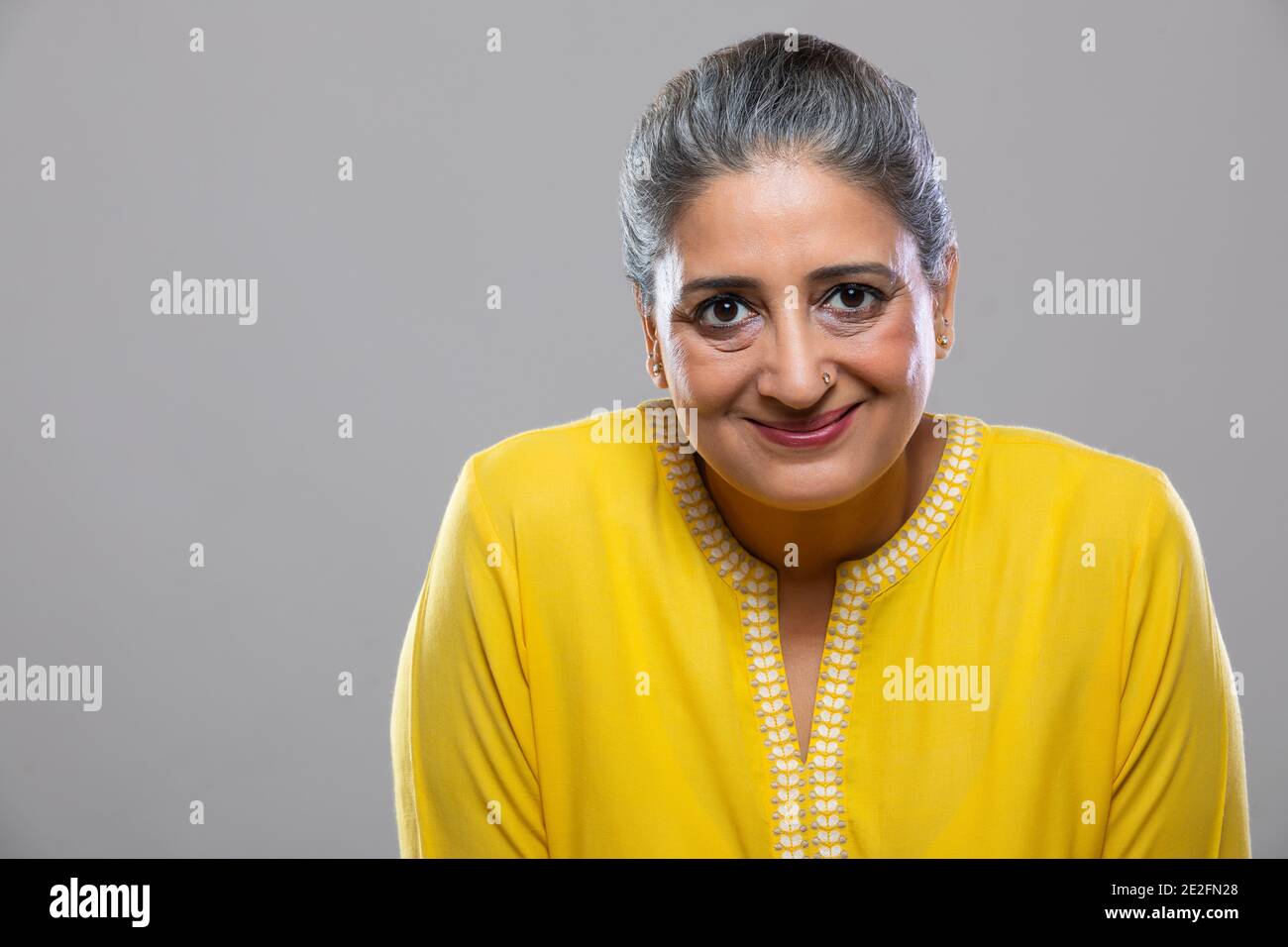 Smiling senior indian woman hi-res stock photography and images - Alamy