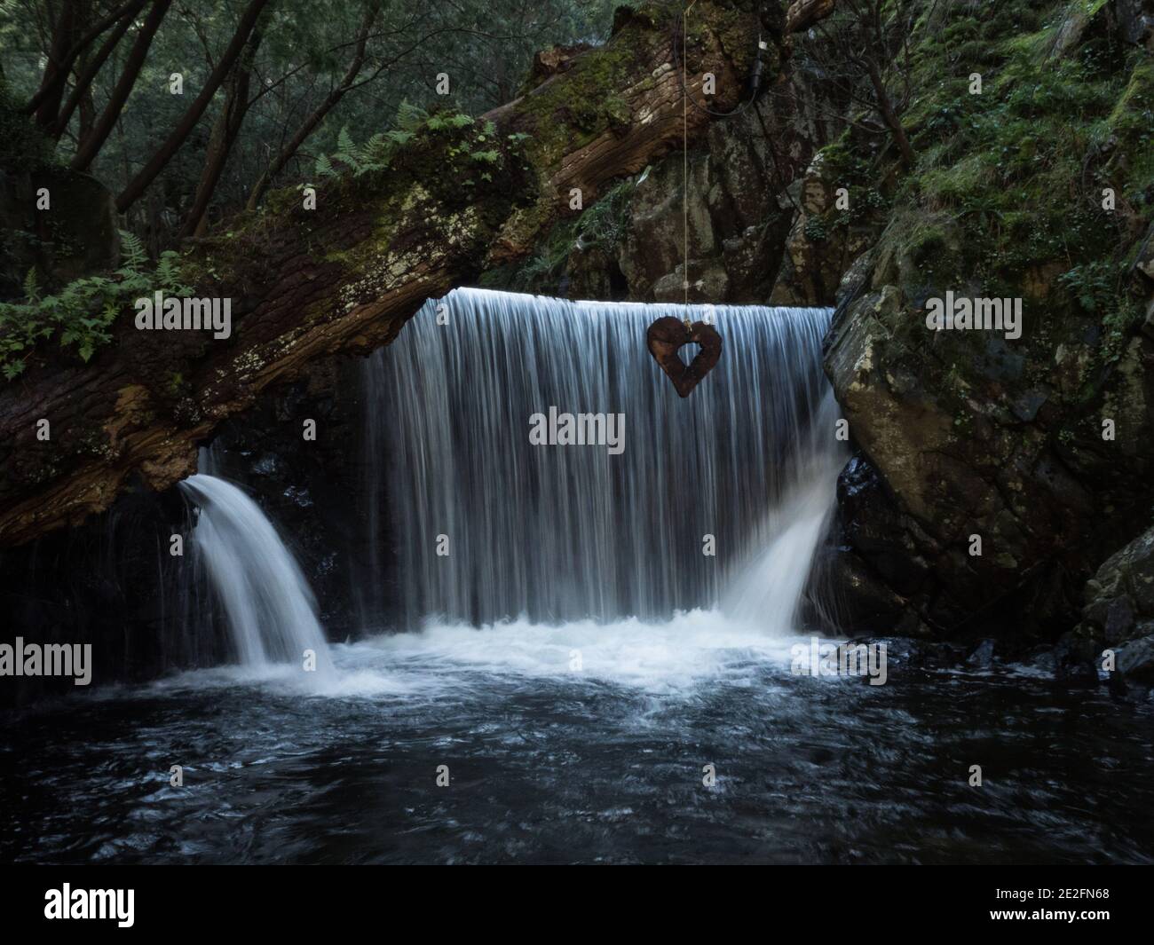 Small waterfall cascade heart shaped wood carving at Piscinas Santuario de Nossa Senhora da Piedade in Lousa Coimbra Portugal Europe Stock Photo