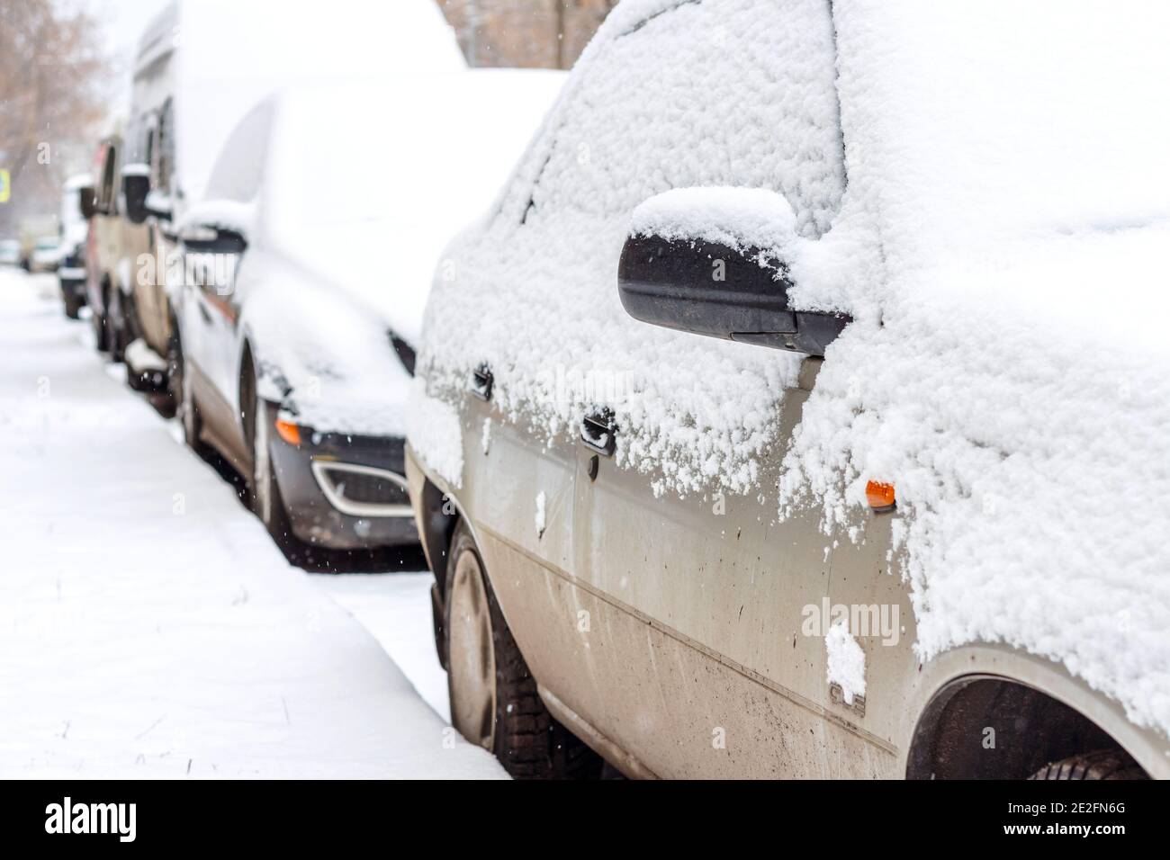 The parked cars in snow. Winter urban scene Stock Photo - Alamy