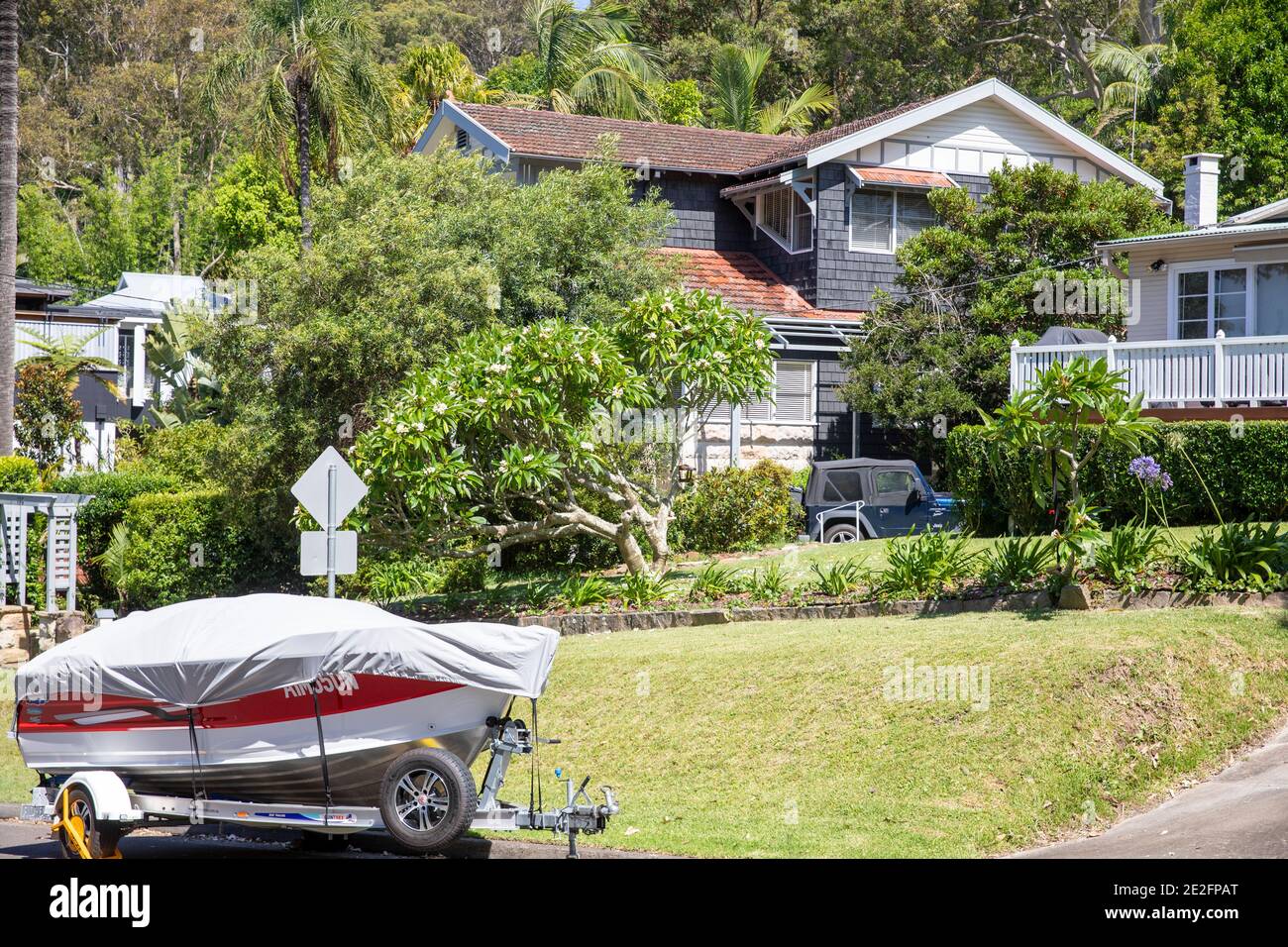 Sydney luxury homes in Sydney northern beaches area with power boat on