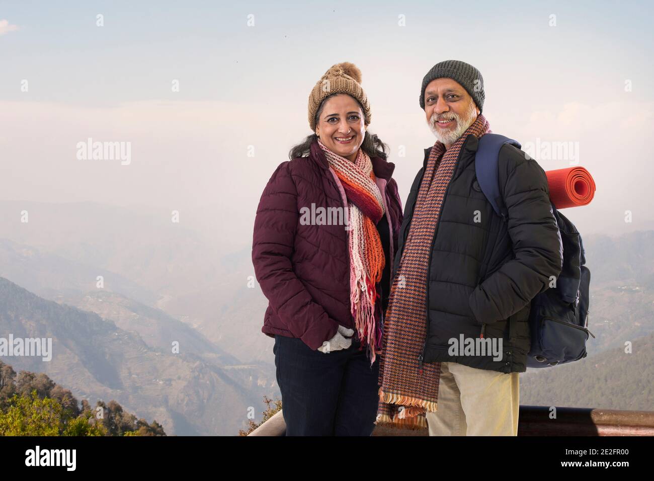 Couple standing on top hill hi-res stock photography and images - Alamy