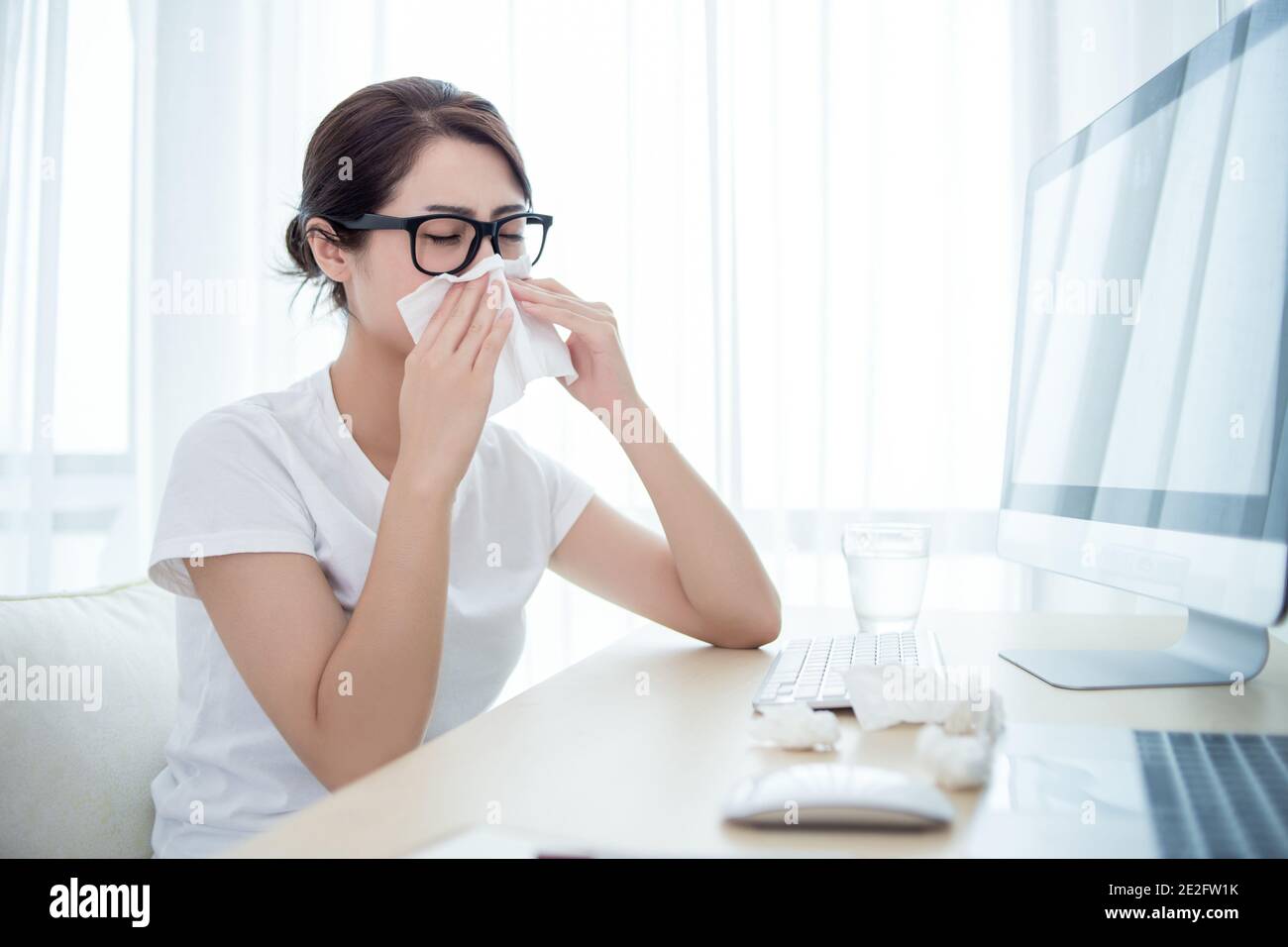 A Woman catches a cold Stock Photo Alamy