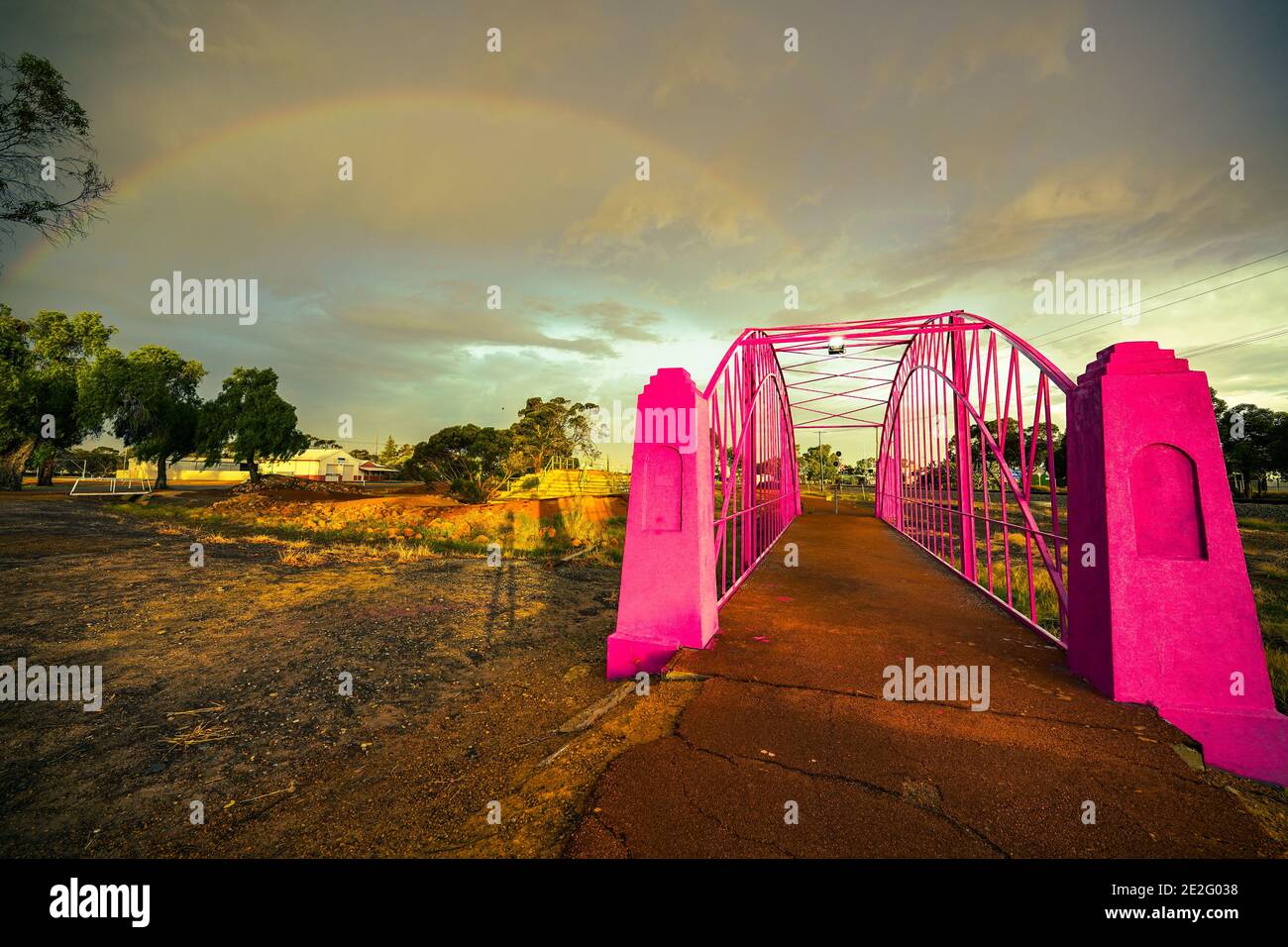 Pink bridge and rainbow after rain Stock Photo