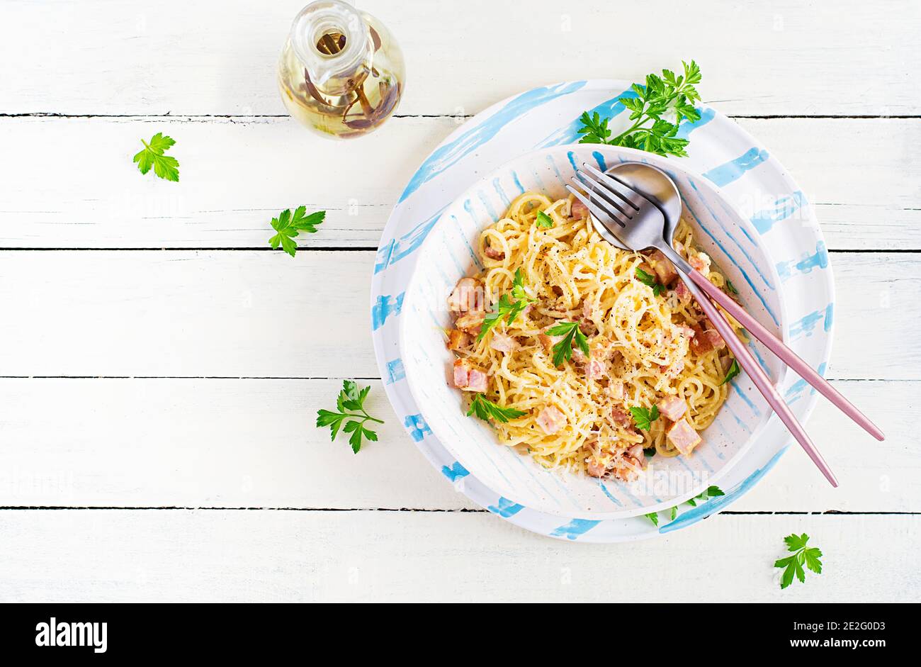 Classic homemade carbonara pasta with pancetta, egg, hard parmesan cheese and cream sauce. Italian cuisine. Spaghetti alla carbonara. Top view, copy s Stock Photo