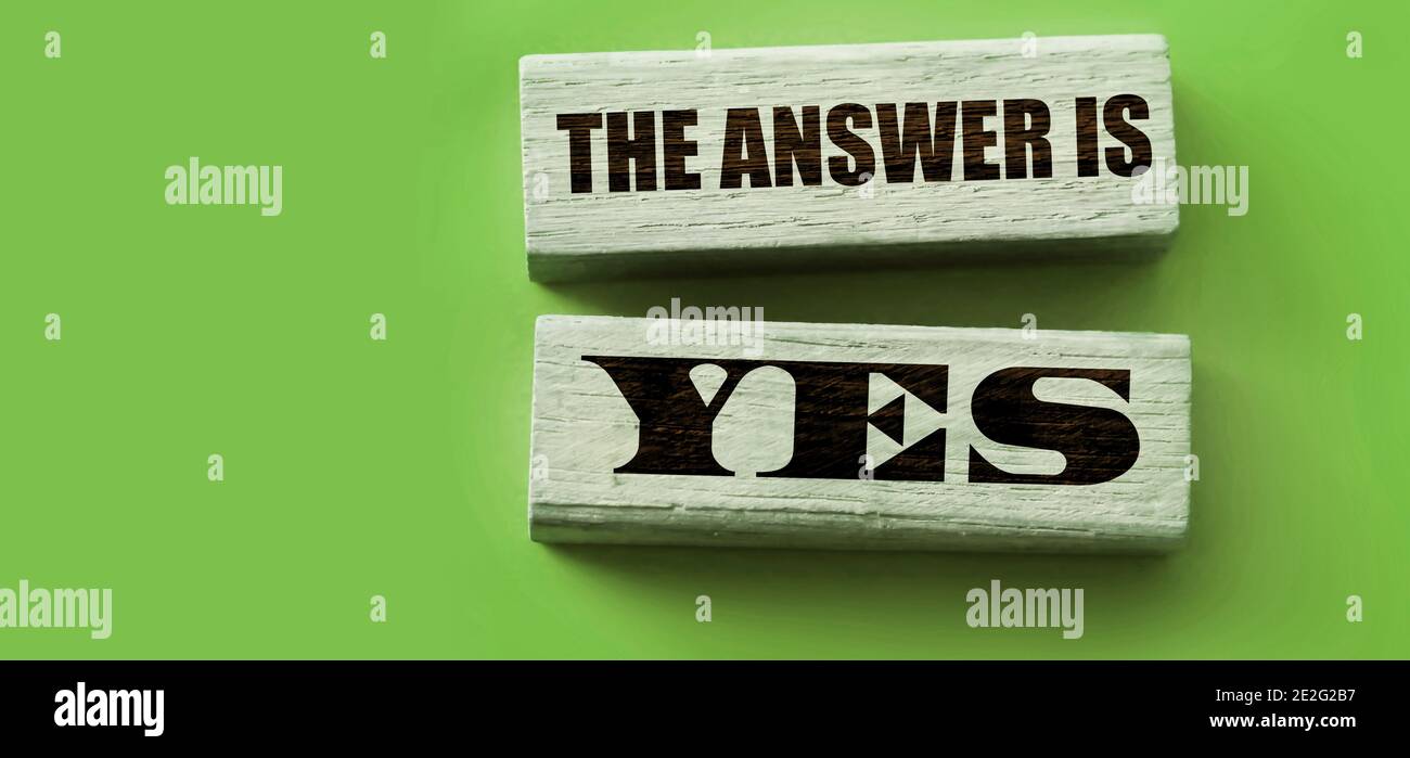 The answer is YES words on wooden blocks put on yellow background ...