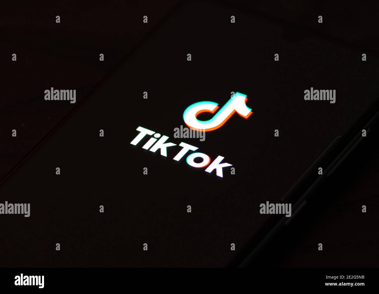TikTok logo, app icon, logo displayed on a smartphone Stock Photo