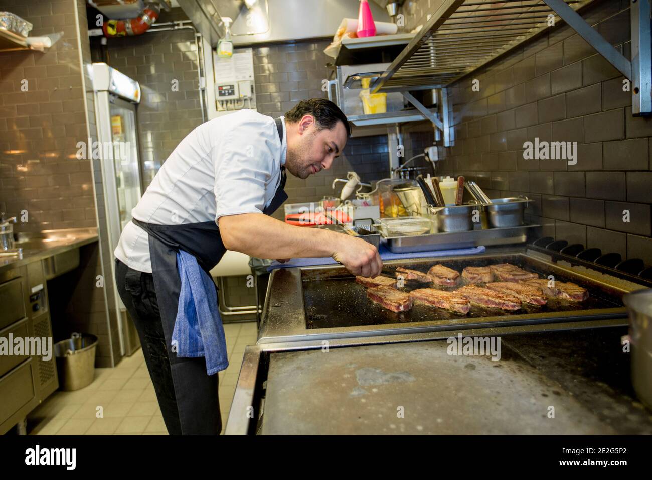 The chef prepares the restaurant food. Stock Photo
