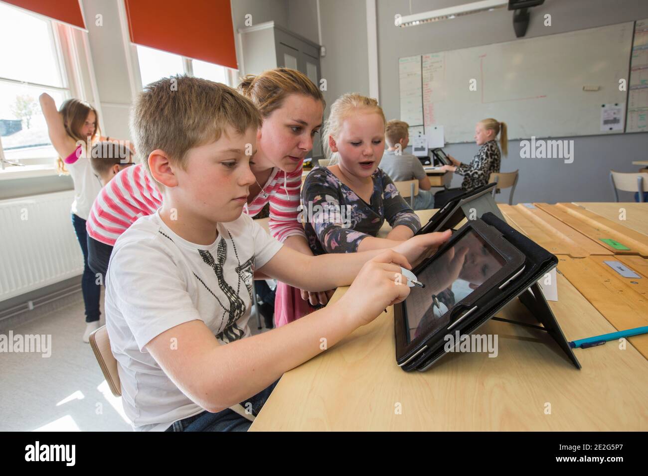 Children use the iPad in teaching. Stock Photo