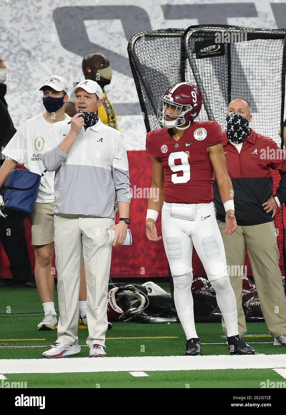 January 1, 2021 Arlington, TX.Alabama Crimson Tide freshman back-up  quarterback (9) Bryce Young who did not play, pictured with former Texas,  and Houston head coach Major Applewhite, who is now an Offensive