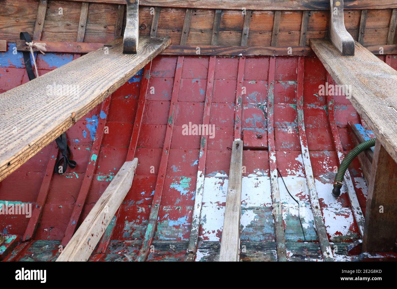 Interior of old painted weathered wood boat hull with copy space Stock