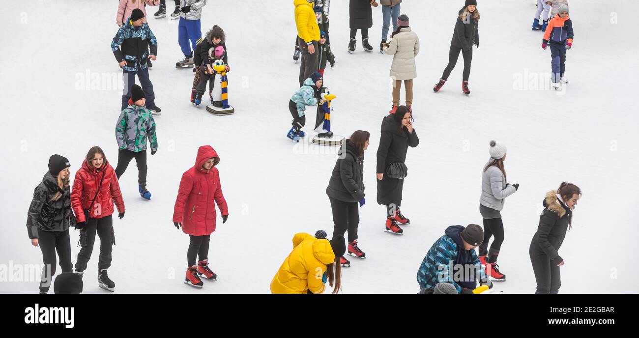 KYIV, UKRAINE - Jan. 03, 2021: Ice-skating people. People have fun in ...