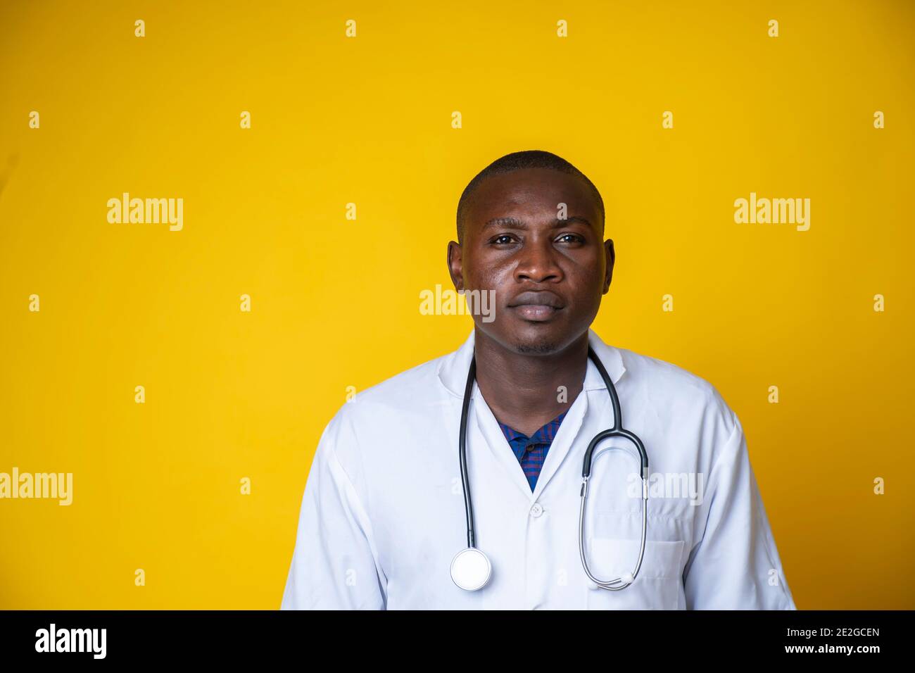 young handsome black medical doctor wearing his lab coat and hanging his stethoscope on his neck Stock Photo Alamy