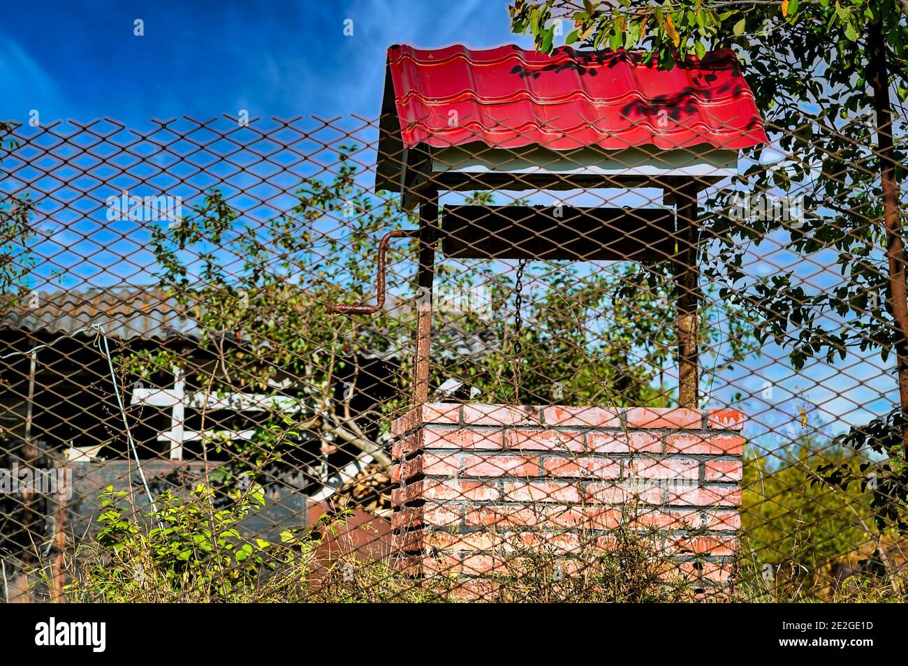 Brick water well wooden roof hi-res stock photography and images - Alamy