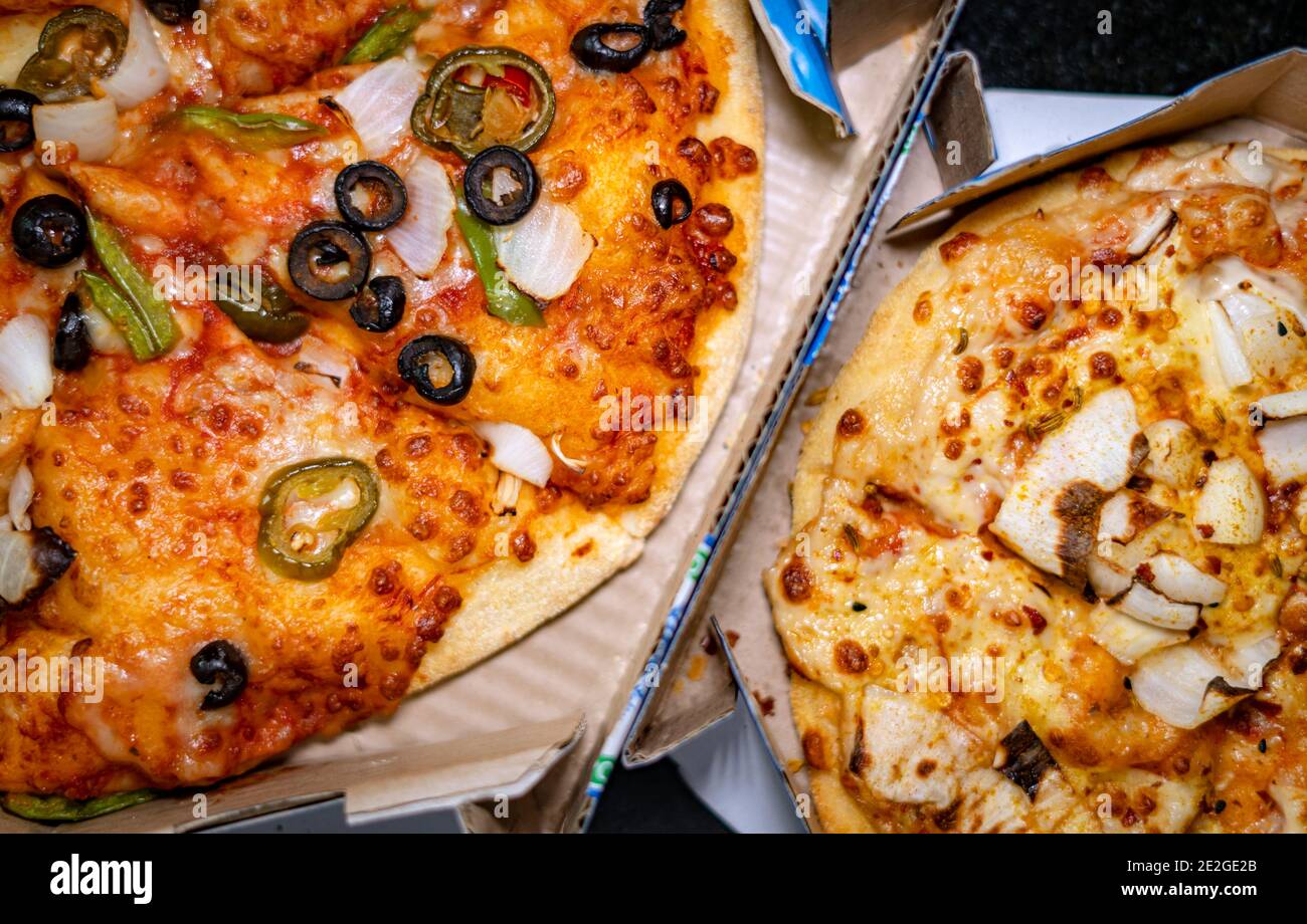 Top view of two different vegetarian pizzas in their takeout boxes Stock Photo