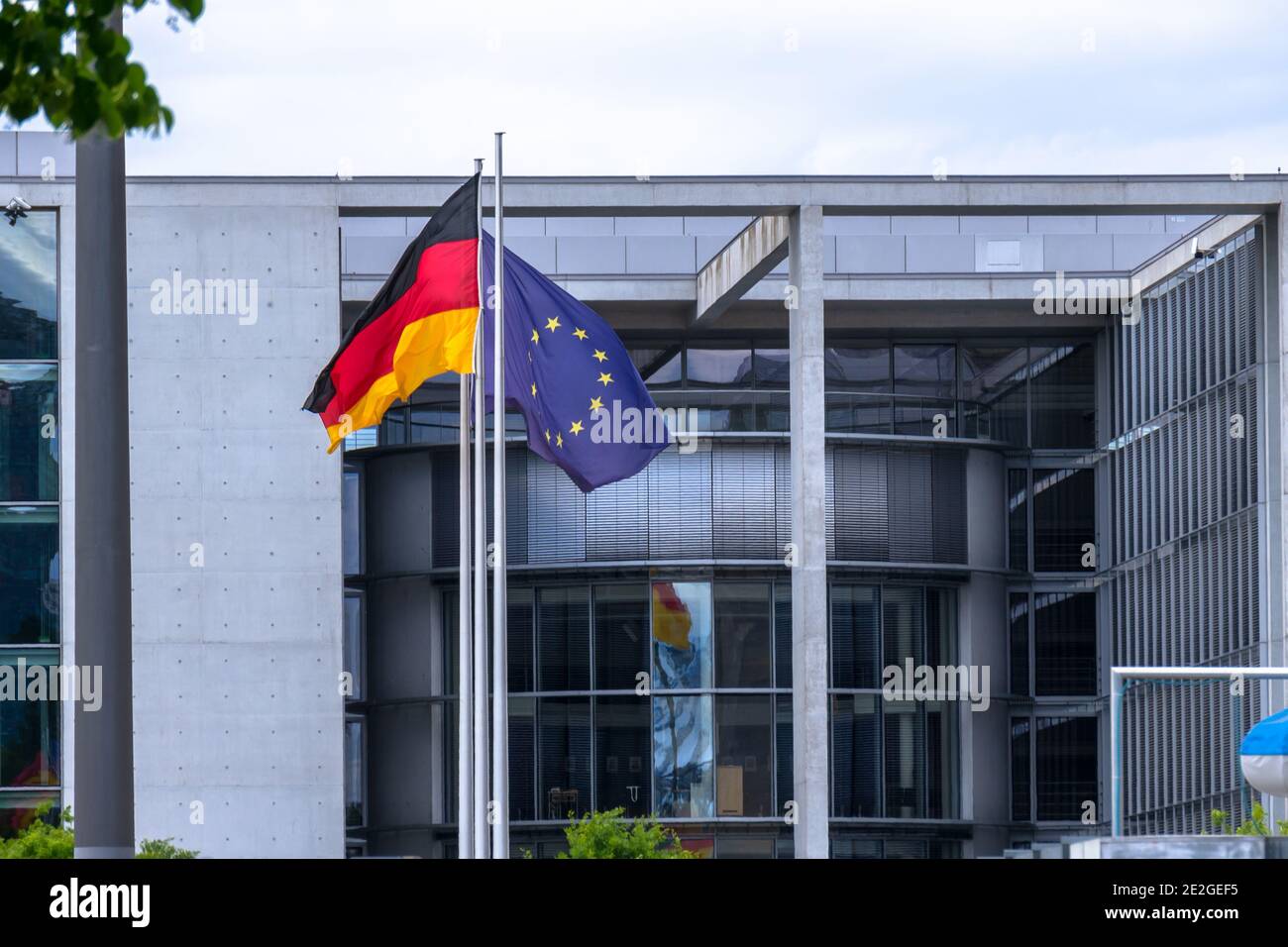 BERLIN, GERMANY - Jun 16, 2020: German and EU flag in opposite directions at the German Bundestag at the Reichstag. Stock Photo